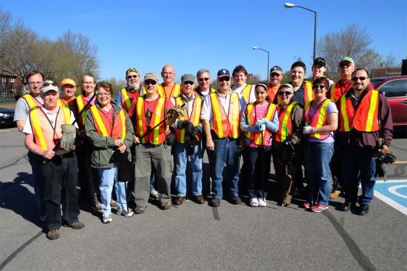 Holy Cross Council team prepares to pick up litter along the Airport Parkway