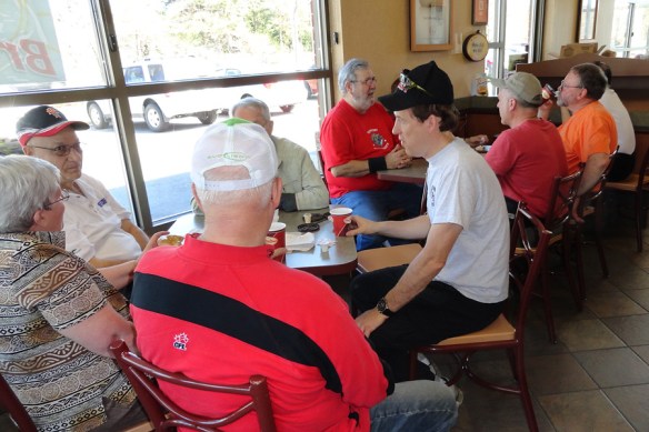 Members of the team relax over coffee and donuts.