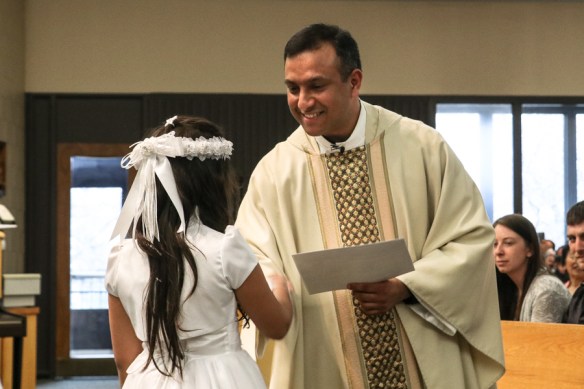 Fr Dominic presents a certificate